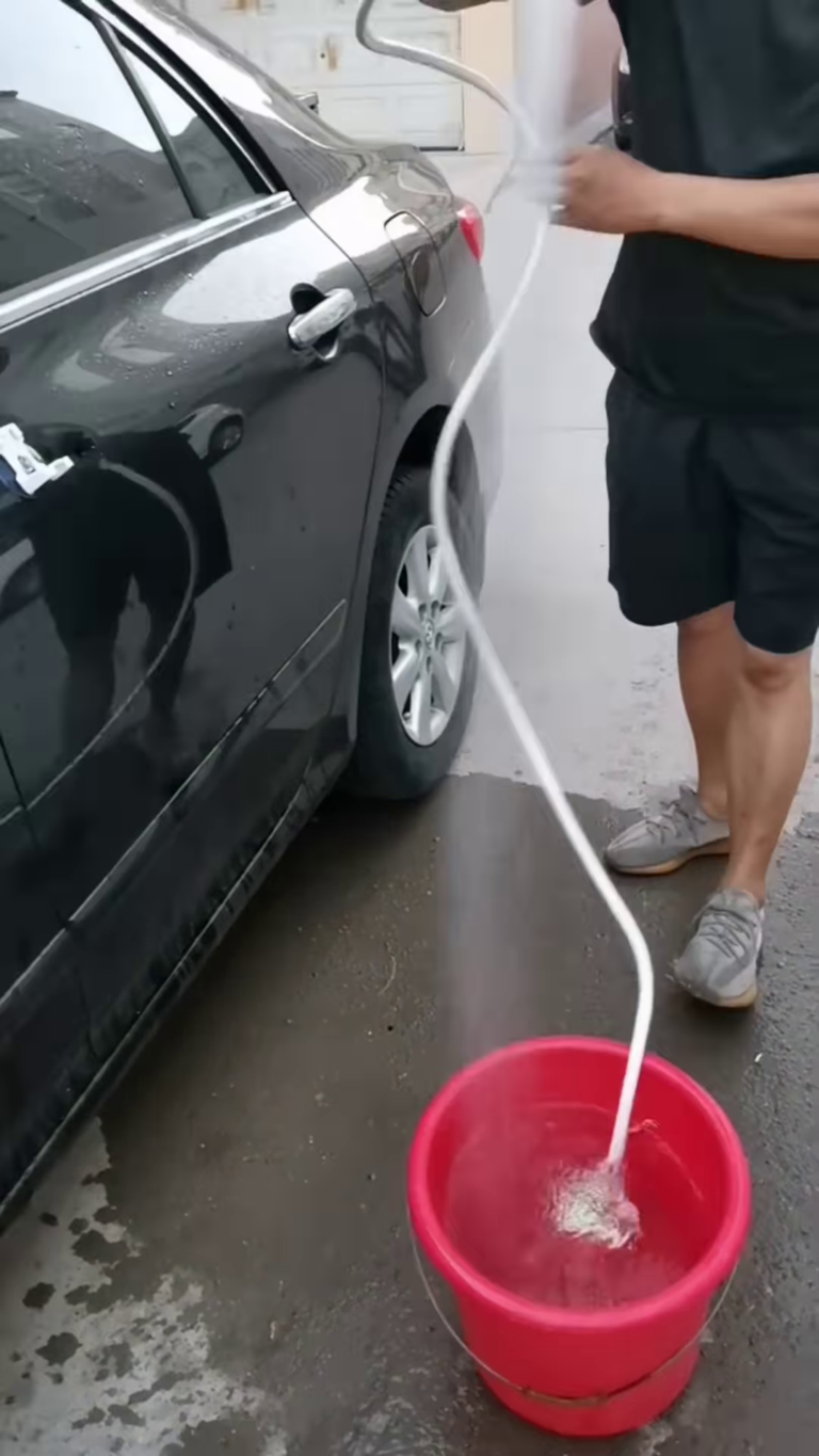 portable car washer with adjustable spray nozzle and integrated soap dispenser