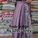 elegant purple net saree with intricate design